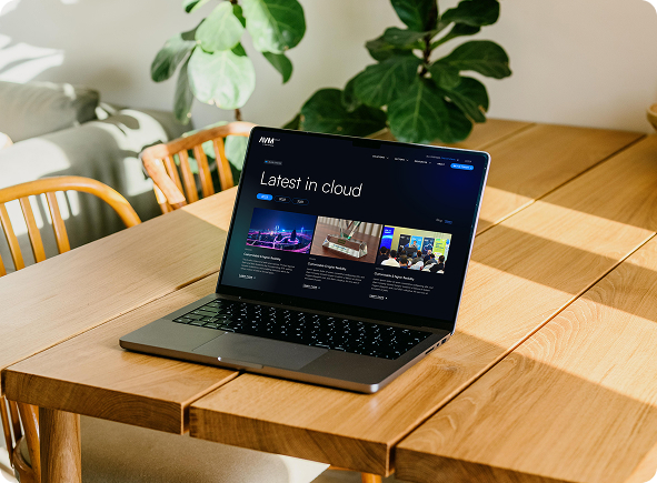 'Latest in cloud', the news hub on laptop.